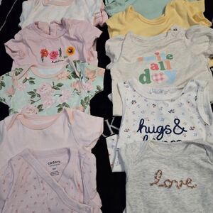 Baby Onesies Assorted Colors sizes 3 to 9 months. 2 onsies for 5$.